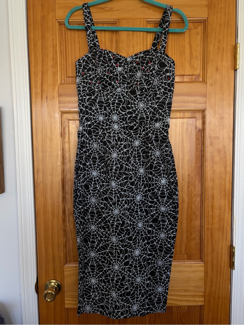 Deadly Dames Black & White Spiderweb Dress with removable red lined peplum
